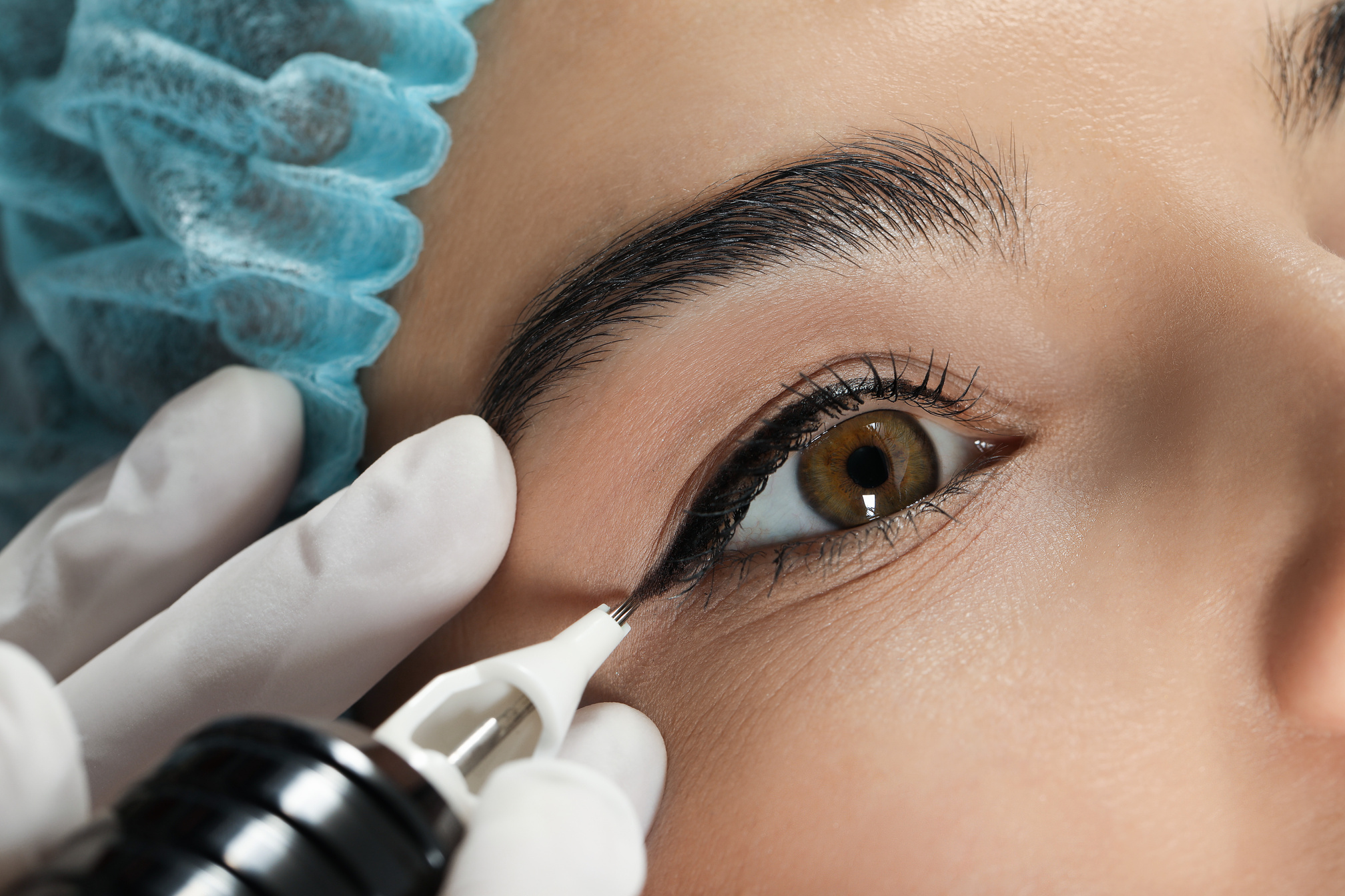 Young Woman Undergoing Procedure of Permanent Eyeliner Makeup, C